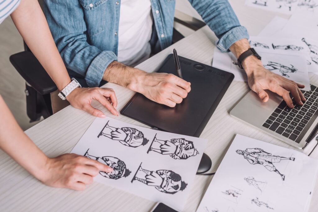 cropped-view-of-illustrator-pointing-with-finger-a-2023-11-27-05-19-22-utc
